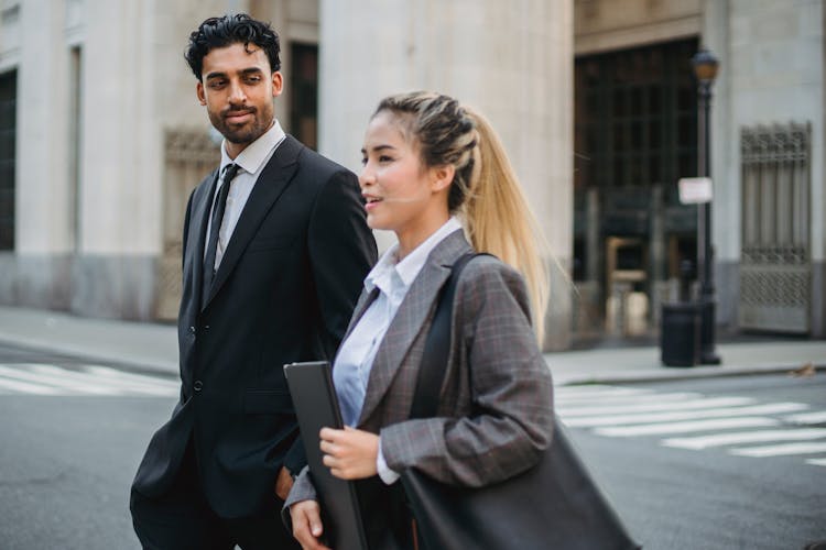 Business People In Formalwear Walking A Street