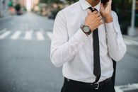Man in White Dress Shirt and Black Pants Wearing Black Necktie