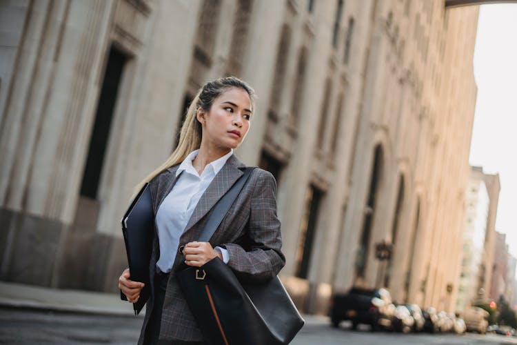 Businesswoman Walking Through The City 