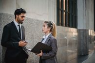 Businessman and Businesswoman Talking