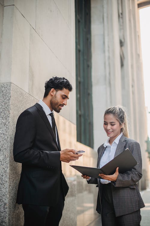 Free Man in Black Suit Jacket Holding Black Tablet Computer Stock Photo