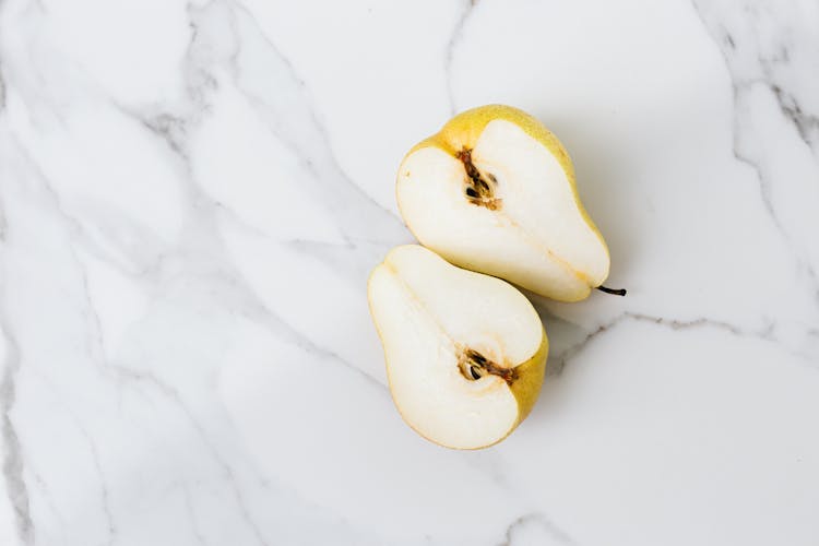 Sliced Pear On White Surface