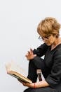 Woman with Eyeglasses Reading Book