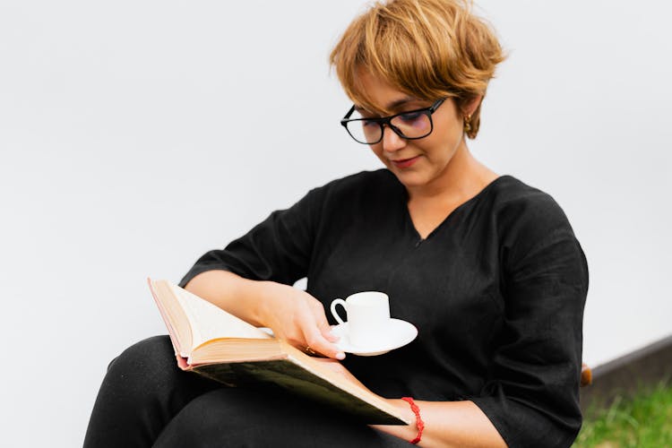 Woman Reading Book Drinking Coffee