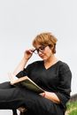 Woman in Black Long Sleeve Shirt Reading Book
