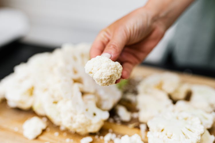 Single Cauliflower Rosette In Hand Of Cook