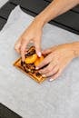 Woman Putting Fruit on a Waffle