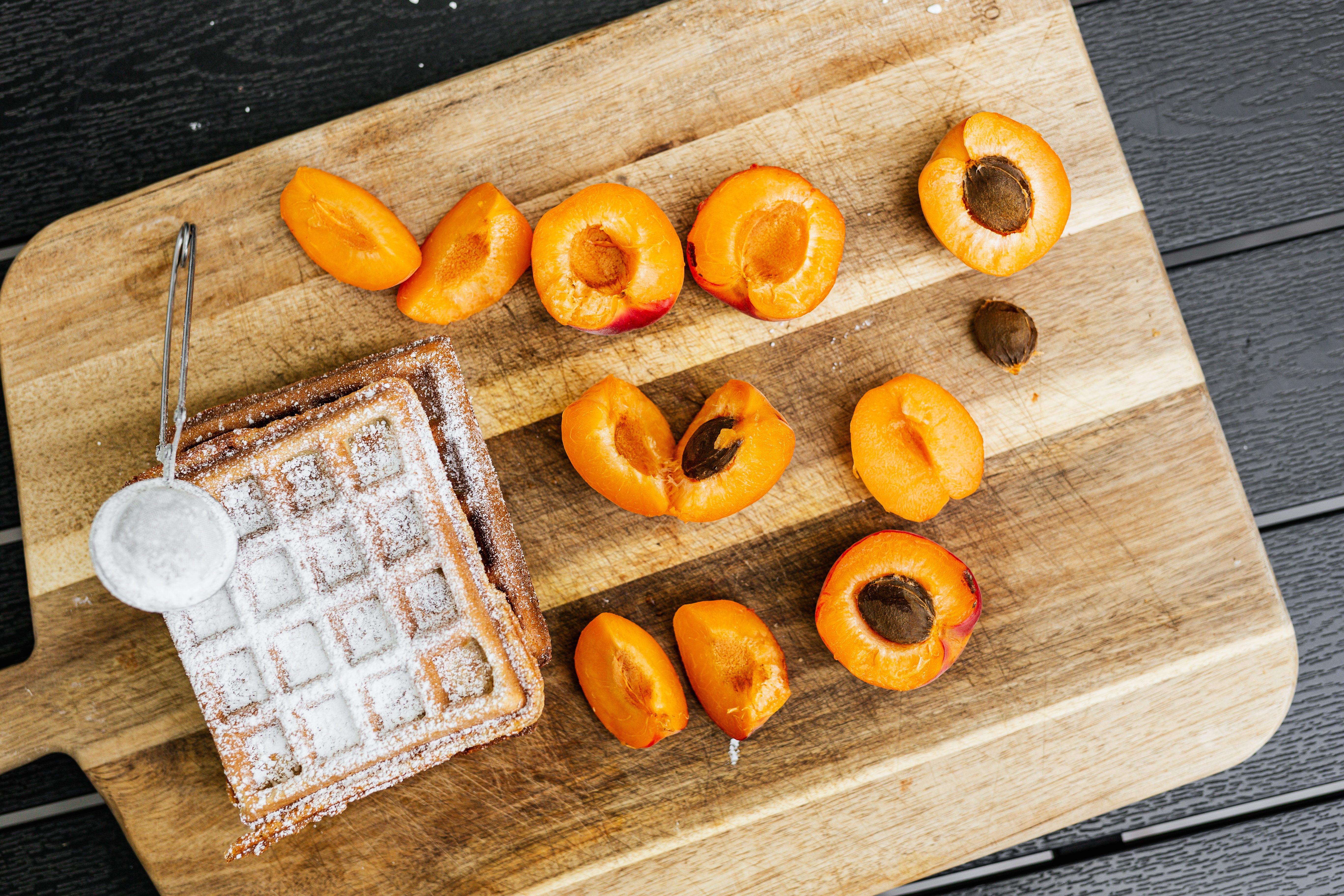 Creamy risotto pudding served with brown sugar glazed apricots