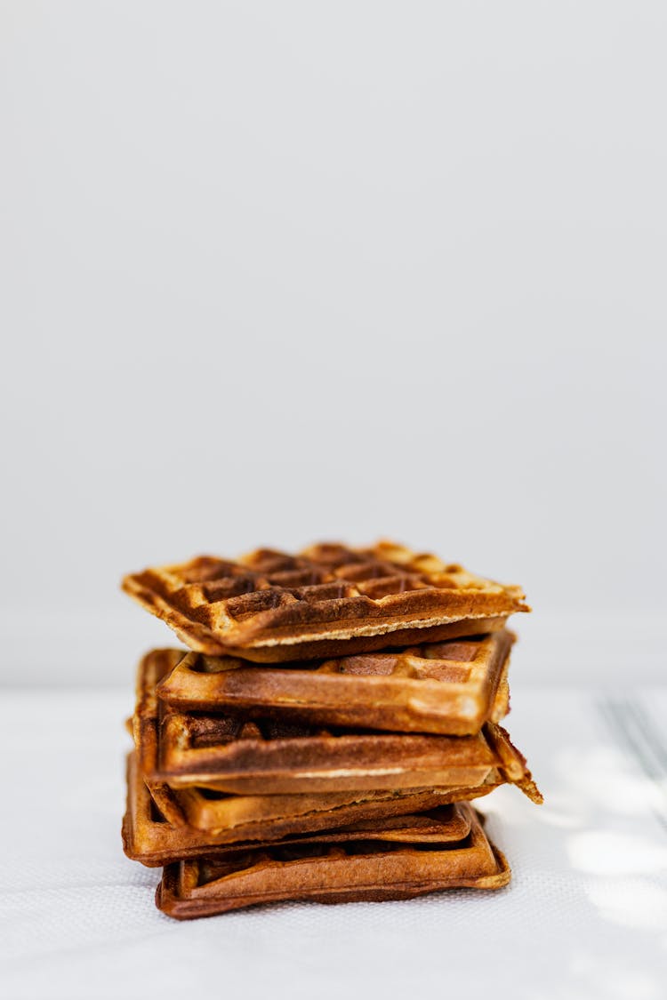 Stack Of Waffles On Studio White Background