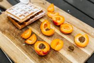 Sliced Orange Fruit on Brown Wooden Chopping Board