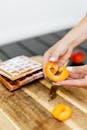 Hands Holding a Peach