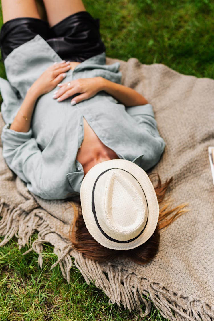 Woman Napping With Hat On Her Face