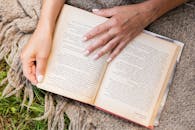 Overhead View of Hands on Book