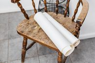 White Pillar Candle on Brown Wooden Table