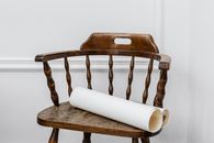 White Tissue Roll on Brown Wooden Chair
