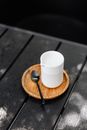 White Ceramic Mug on Brown Wooden Coaster