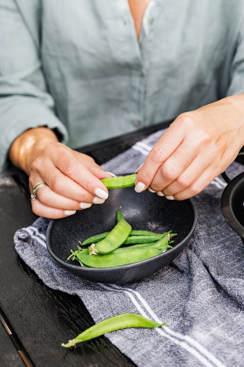 Person Holding Green Vegetable