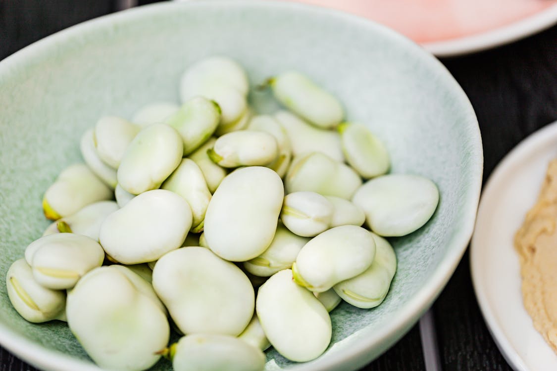 Green Round Fruit on White Ceramic Bowl