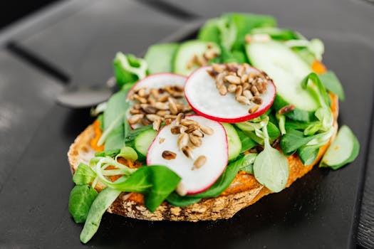 Delicious and nutritious open-faced vegetable toast with fresh greens, radishes, and seeds, perfect for a healthy snack.