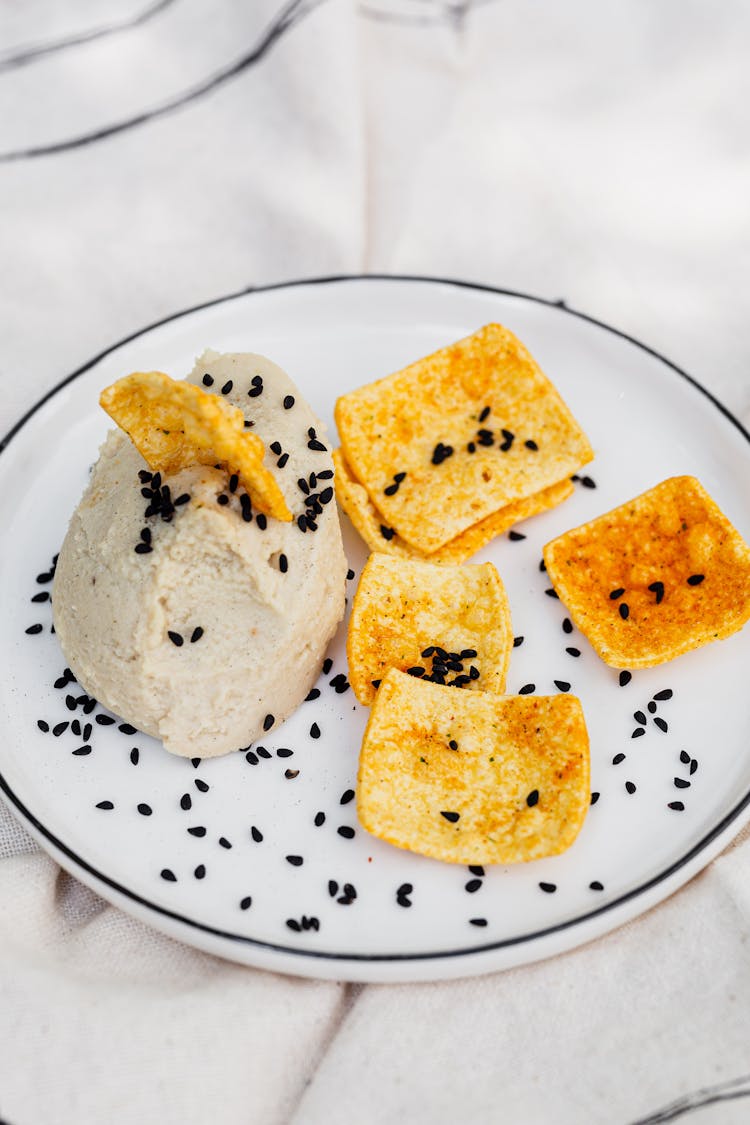 Hummus With Chips On A Plate