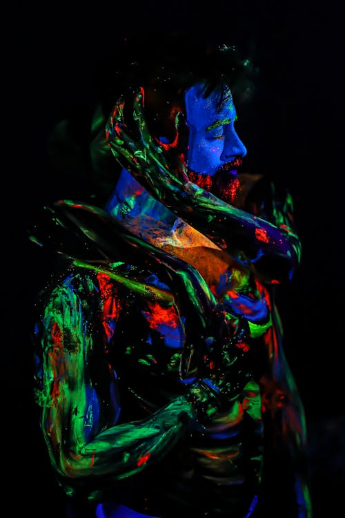 Free Woman with Glowing Fluorescence Paint on Body Stock Photo