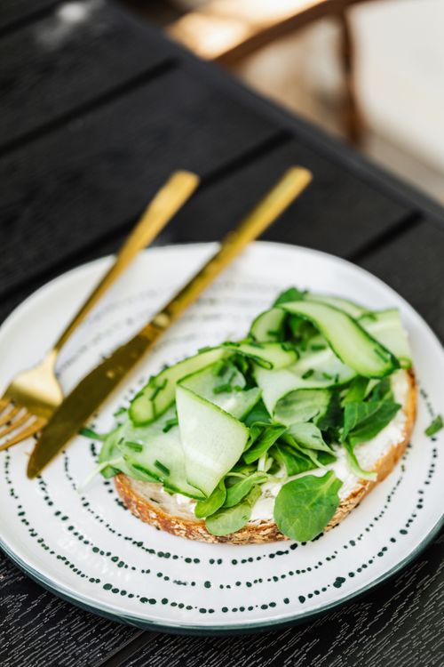 Free Close-up of a cucumber sandwich on artisan bread with fresh greens, perfect for healthy eating. Stock Photo