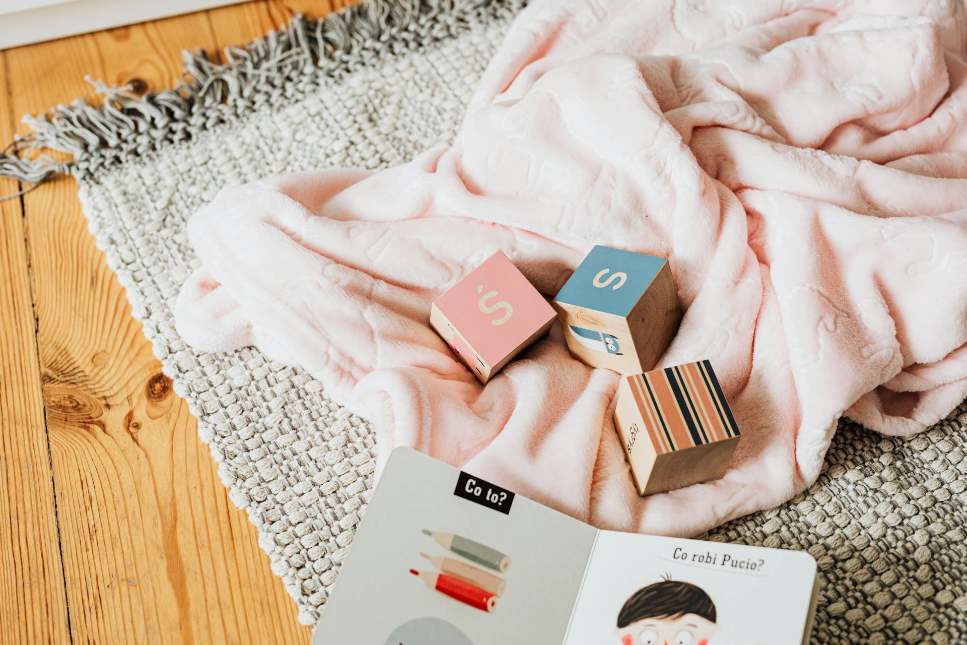 Handbook for Children and Colorful Blocks on the Floor