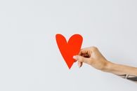 Person Holding Red Heart Paper