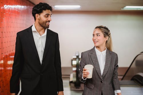 Free Man and Woman in Blazer Looking at each other Stock Photo
