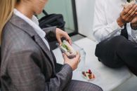 Man in Black and Gray Plaid Blazer Holding Clear Glass Bowl
