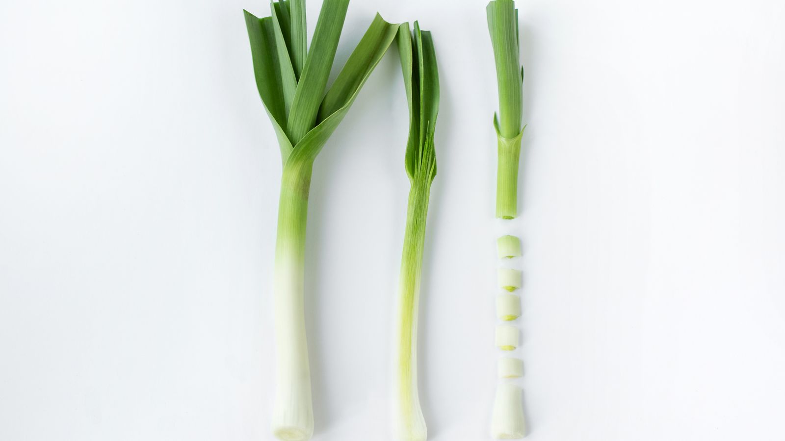 Fresh leeks in whole, trimmed, and sliced stages — photo by Larisa P. on Pexels Fresh leeks in whole, trimmed, and sliced stages