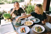 Man and Woman Eating Dinner on a Terrace