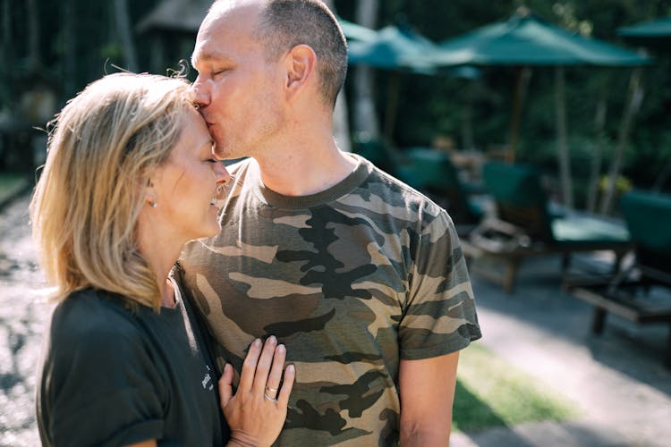 Husband Kissing Wife On Forehand