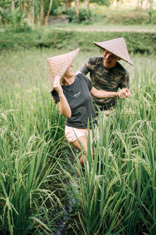 Smiling Couple on Rice Field