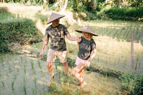 Smiling Couple on Rice Field