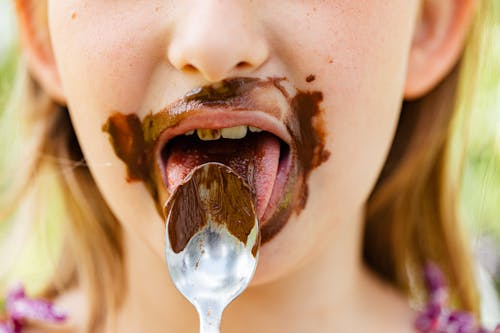 Girl Eating Chocolate Cream