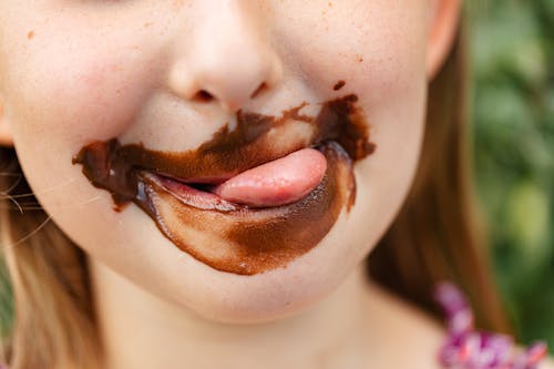Free Little Girl With Chocolate Covered Face Stock Photo