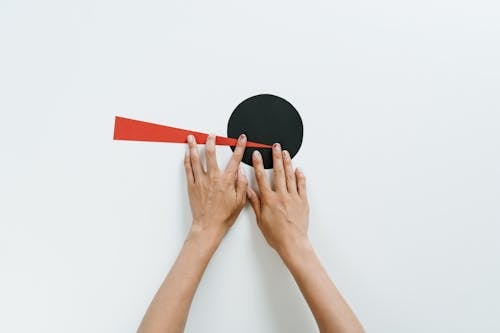 Persons Hand on White Surface