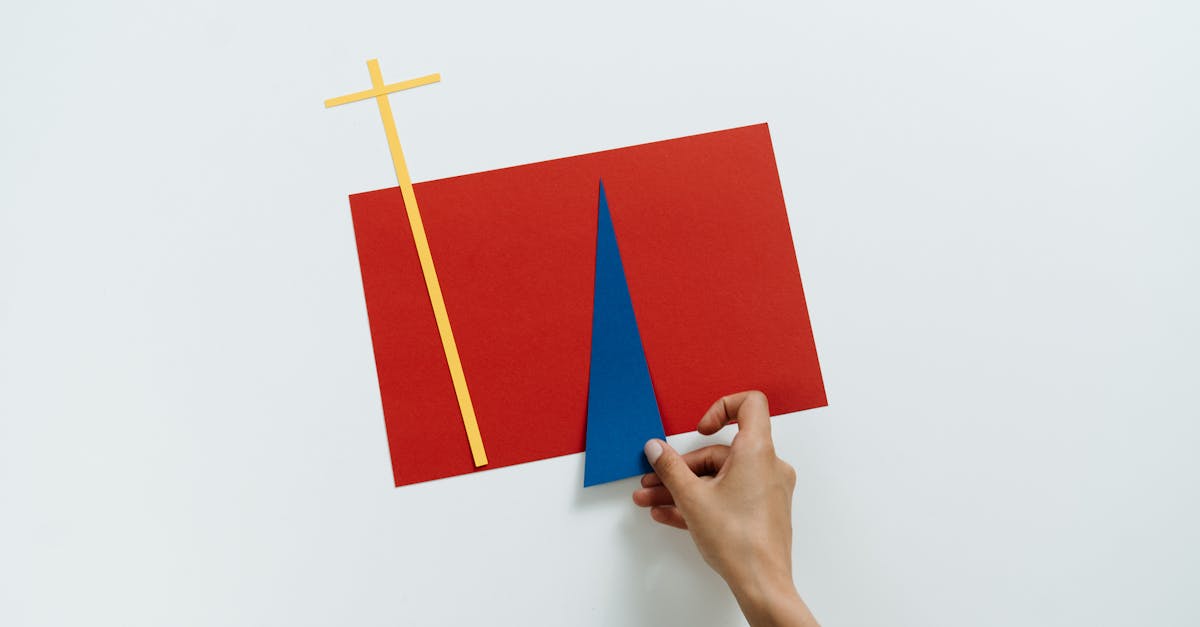 A creative flat lay of geometric shapes using colorful paper in a minimalist style.