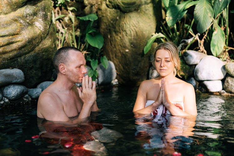 Couple Meditating In Pond