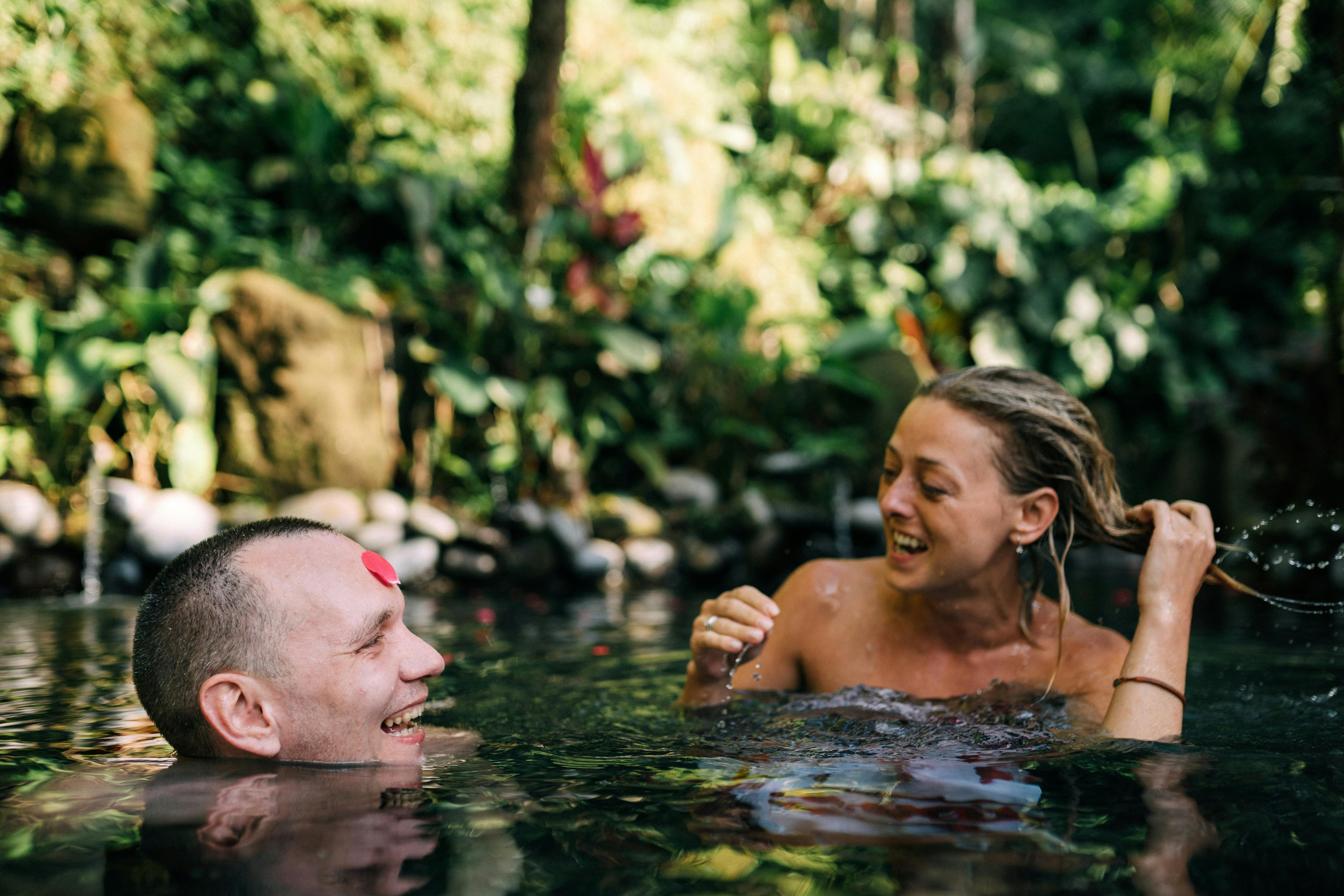 couple swimming and smiling