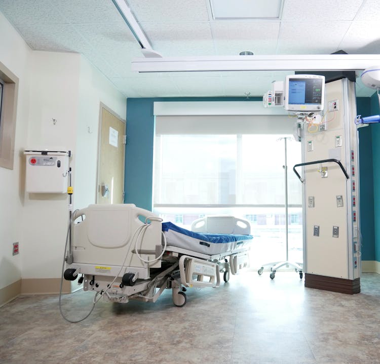 Hospital Bed Near The Glass Window