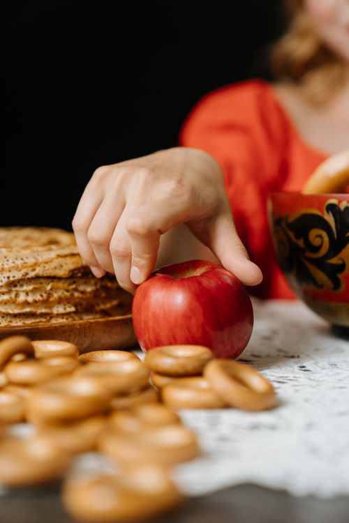 Free Exploring traditional Russian cuisine with sushki, apple, and decorative table setting. Stock Photo