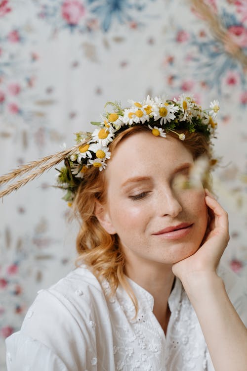 Woman in White Shirt With White and Yellow Flower Crown