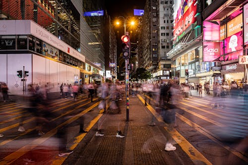 People Walking on the Street at Night