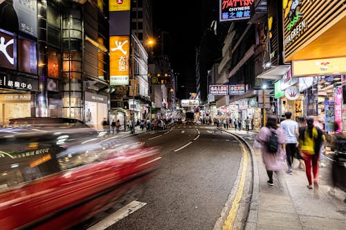 People Walking on the Street at Night