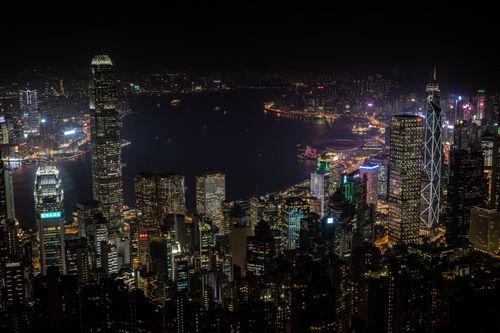 Free Vibrant cityscape of Hong Kong's iconic skyscrapers at night, showcasing city lights. Stock Photo