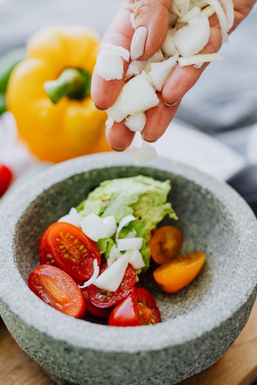 Free Close-up of fresh vegetable salad preparation with tomatoes and onions. Stock Photo