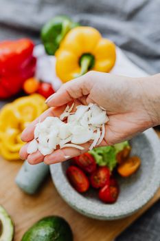Chopped onions and colorful vegetables ready for a fresh salad.