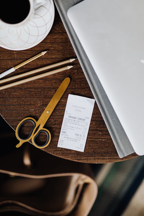 Free A Receipt on a Wooden Table  Stock Photo